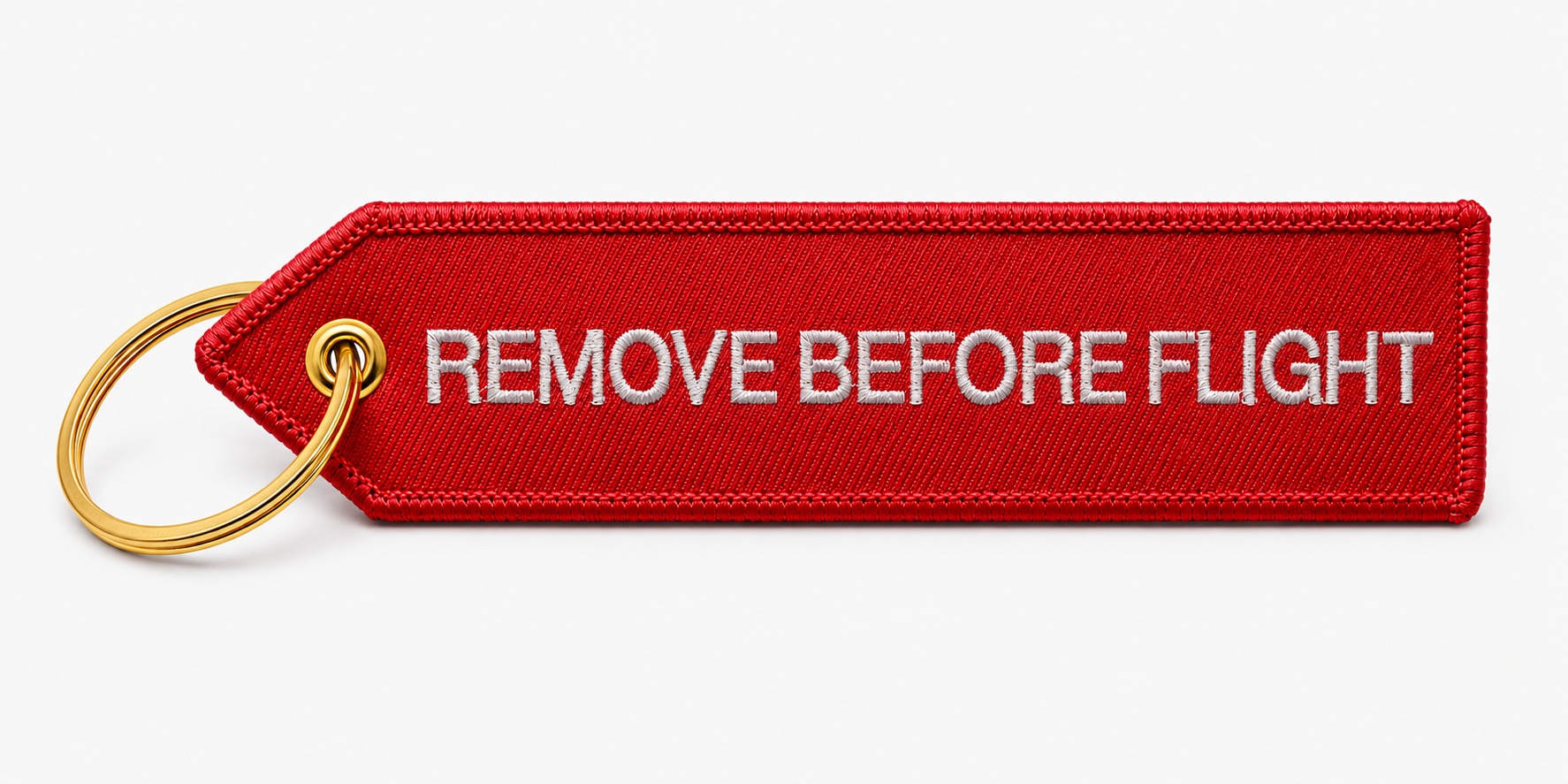 Roter "Remove before Flight" Schlüsselanhänger mit goldenem Ring