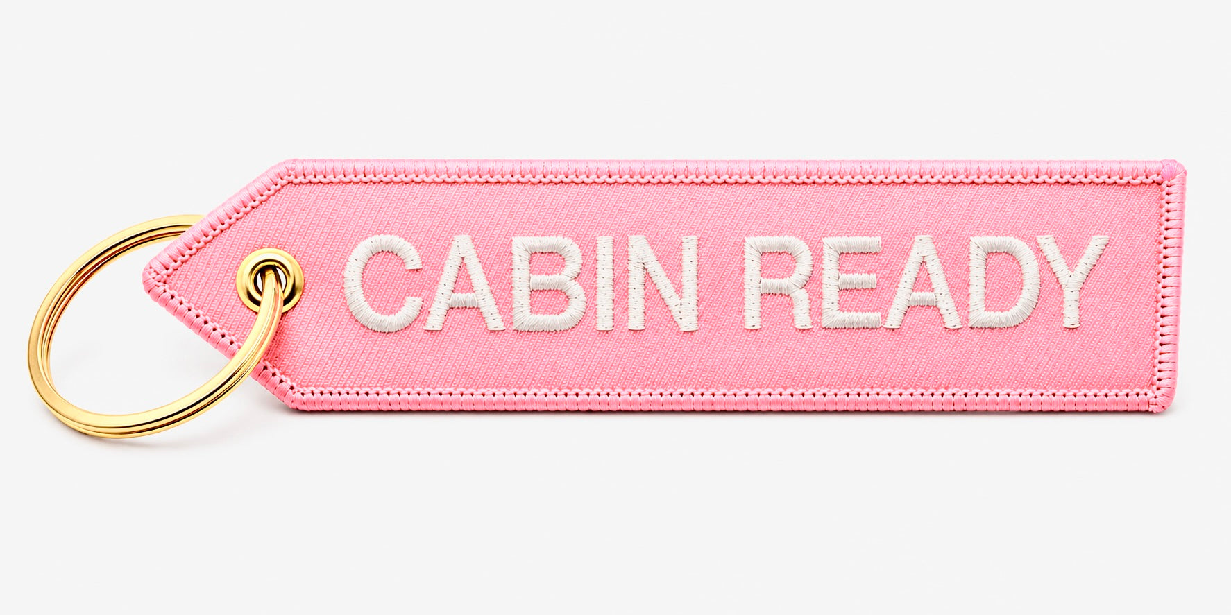 Rosa „Cabin Ready“ Schlüsselanhänger mit weißer Stickerei und goldfarbenem Ring